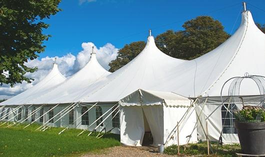 a line of sleek and modern portable restrooms ready for use at an upscale corporate event in Monroe